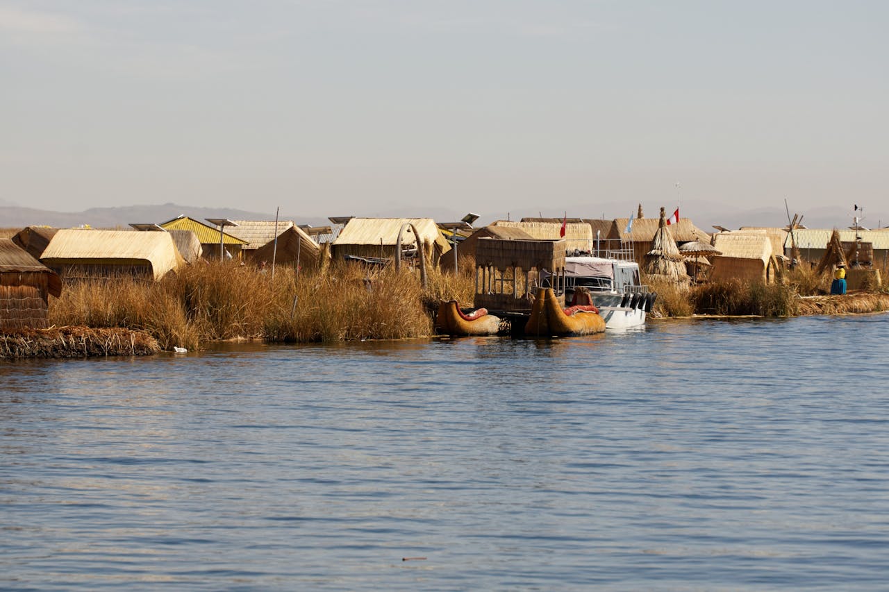 cta-image Explore the unique Uros floating village with traditional reed houses on Lake Titicaca, Puno, Peru.